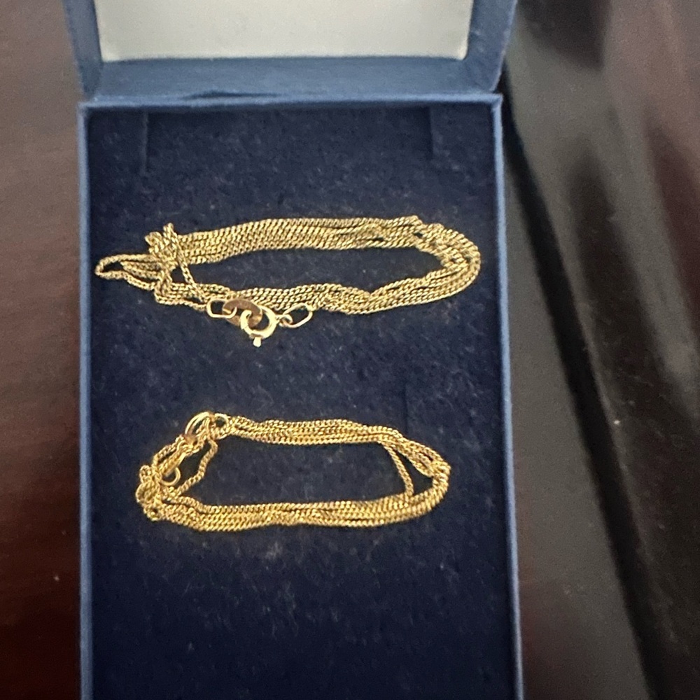Two Elegant Gold Chain Necklaces. One is 10k and the other is 14k selling set